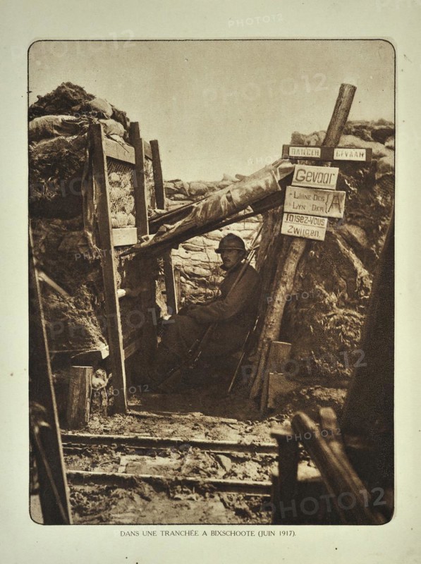Soldier with rifle in trench at Bikschote in Flanders during the First World War