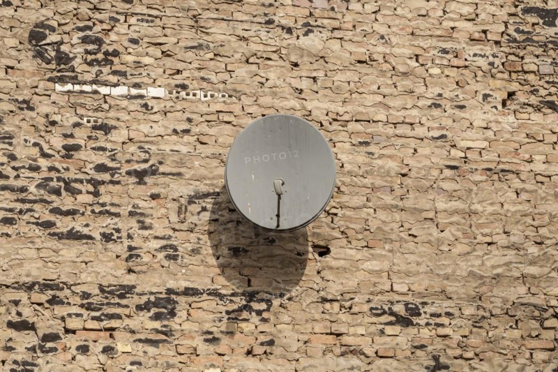 Satellite dish on a wall