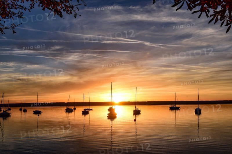 Sailing boats in the sunset in Herrschinger Bucht on Lake Lake Ammer