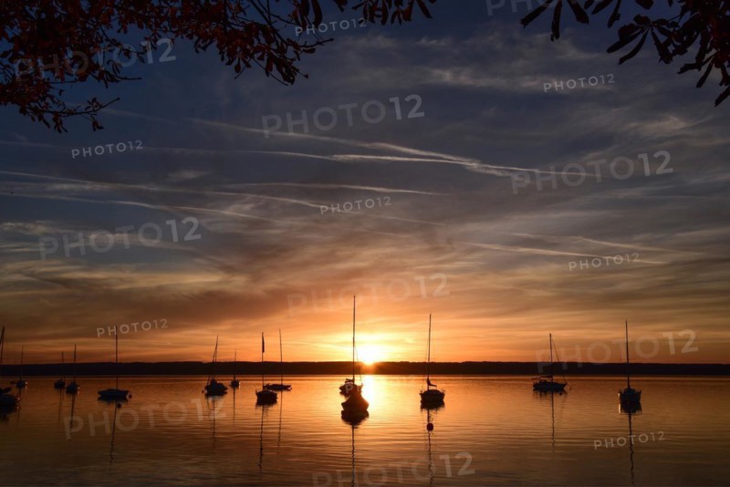 Sailing boats in the sunset in Herrschinger Bucht on Lake Lake Ammer