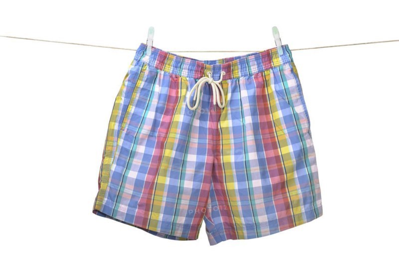 Swim shorts hanging on a washing line