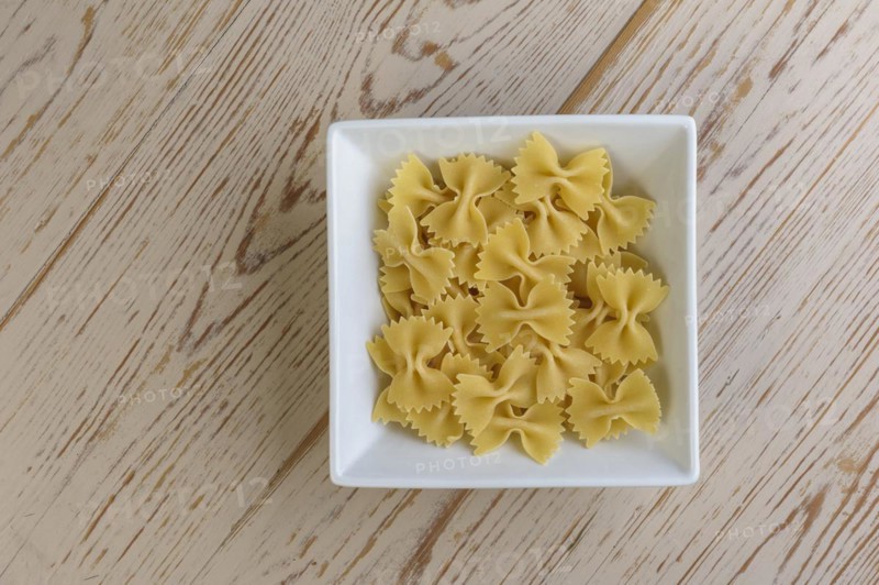 Bowl of uncooked farfalle pasta