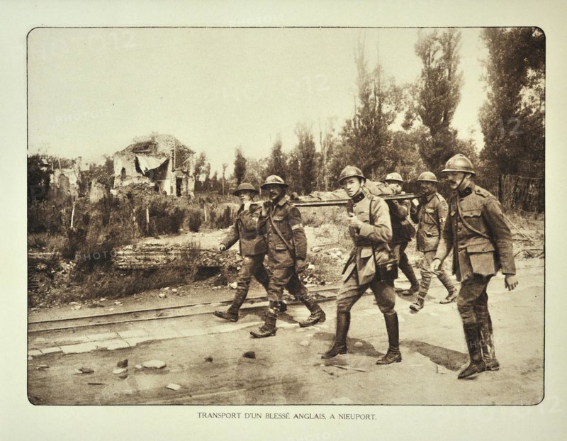 Transport of wounded English soldier on stretcher at Nieuwpoort in Flanders during the First World War