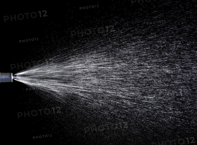 A fine spray of water from a garden sprayer