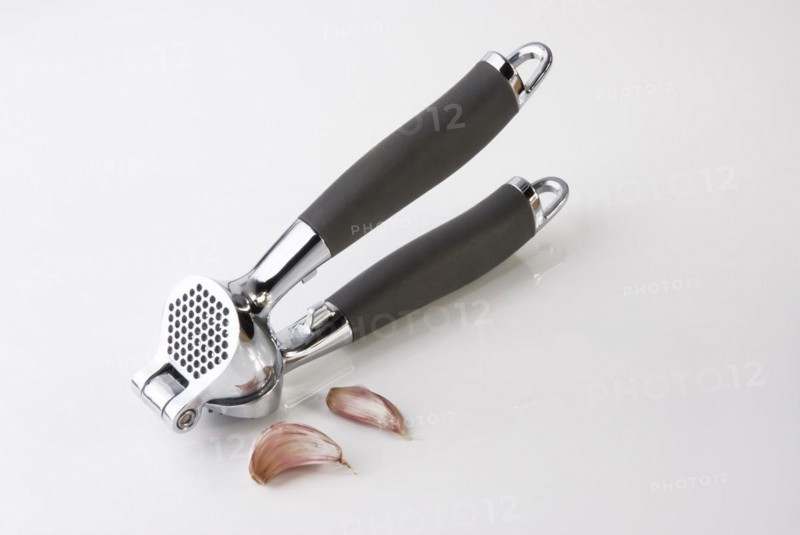 Garlic Press crushing a clove