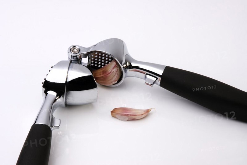 Garlic Press crushing a clove