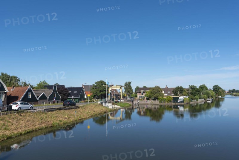 Village scene with canal bridge at the Drechterlandsdijk