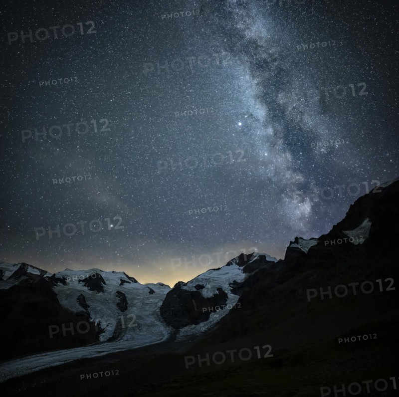 Starry sky with Milky Way over Morteratsch Glacier in Bernina Group