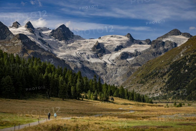Val Rosegg with two walkers and Bernina Group