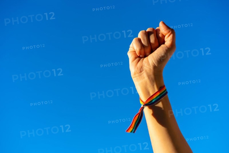 Hand of a woman with closed fist in favor of feminism
