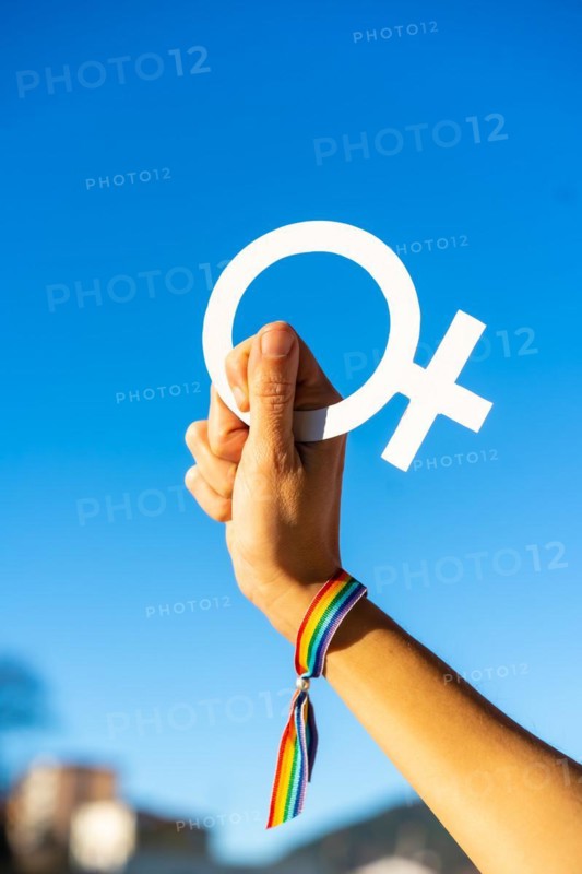 Hand of a woman with female symbol in favor of feminism