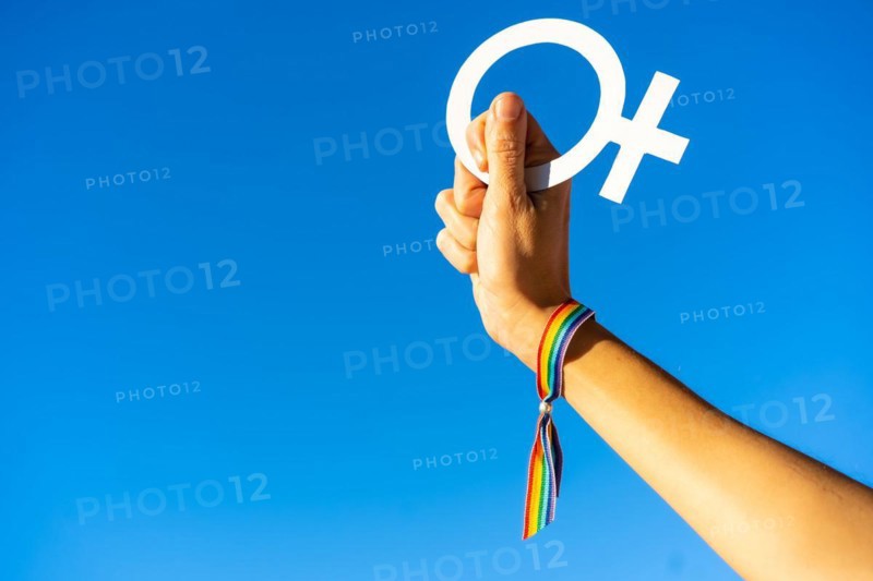 Hand of a woman with female symbol in favor of feminism