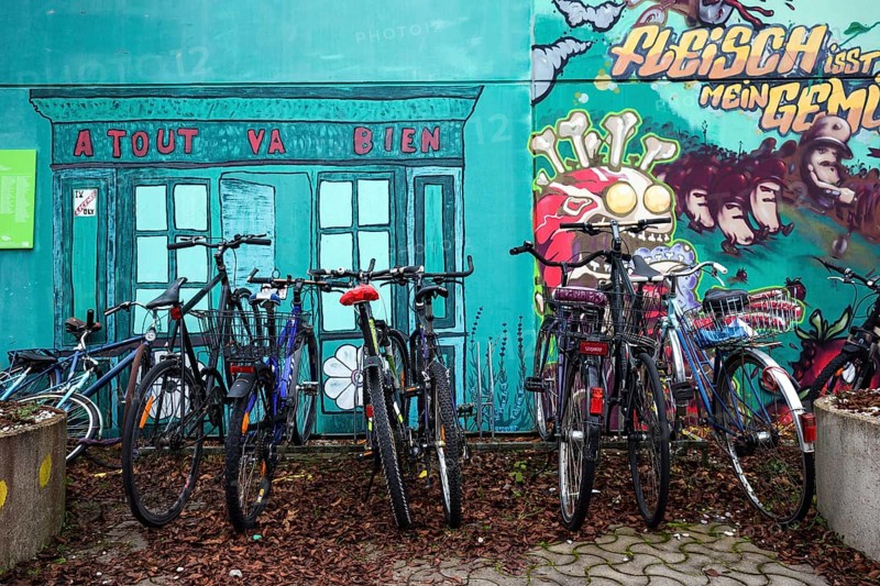 Bicycles in front of mural in the former Olympic Village