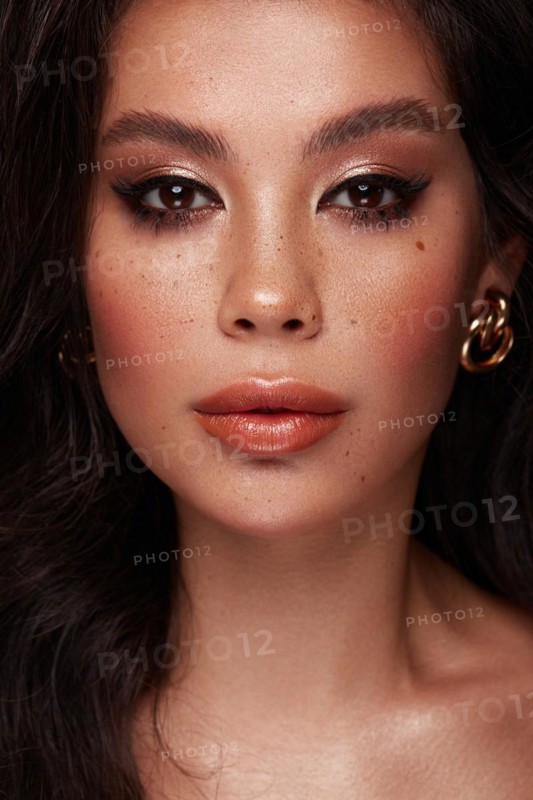 Beautiful Asian brunette model with volume curls