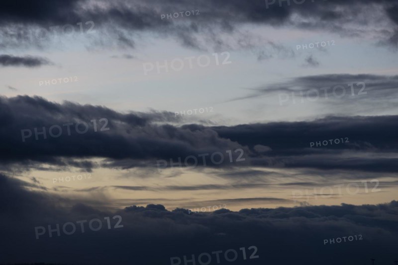 Cloud hole at sunset