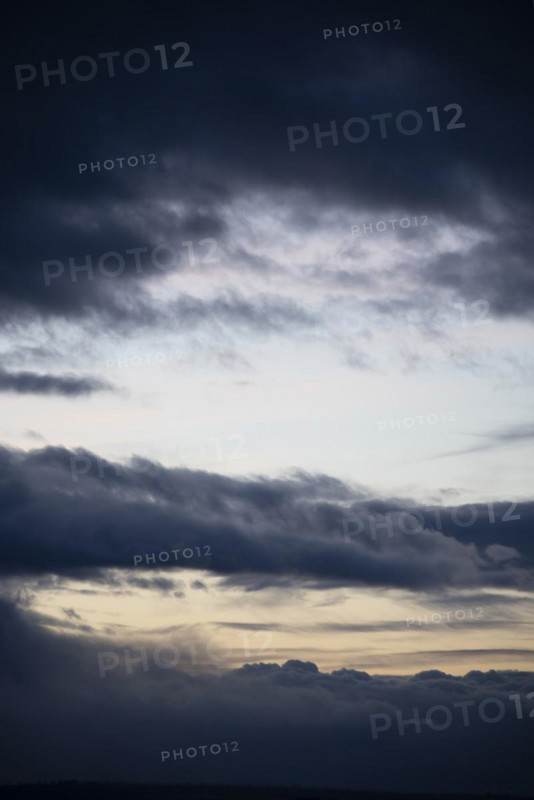 Cloud hole at sunset