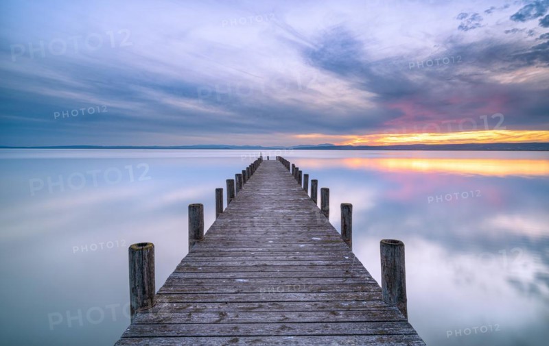 Lake Neusiedl with jetty at sunset
