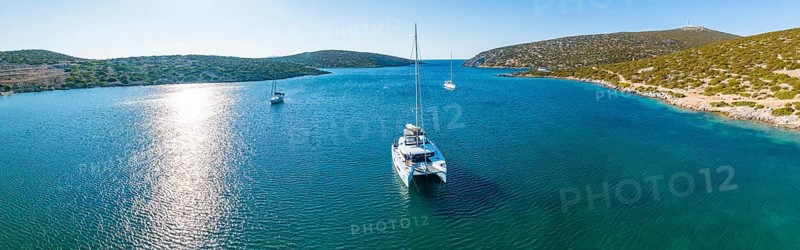Sailing catamaran in a bay