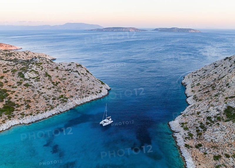Sailing catamaran in a bay of Levitha Island
