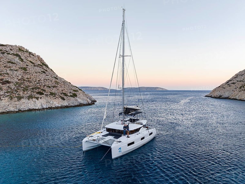 Sailing catamaran in a bay of Levitha Island