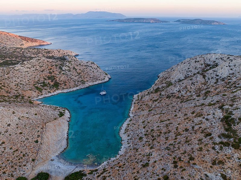 Sailing catamaran in a bay of Levitha Island