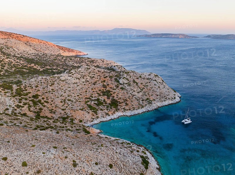 Sailing catamaran in a bay of Levitha Island