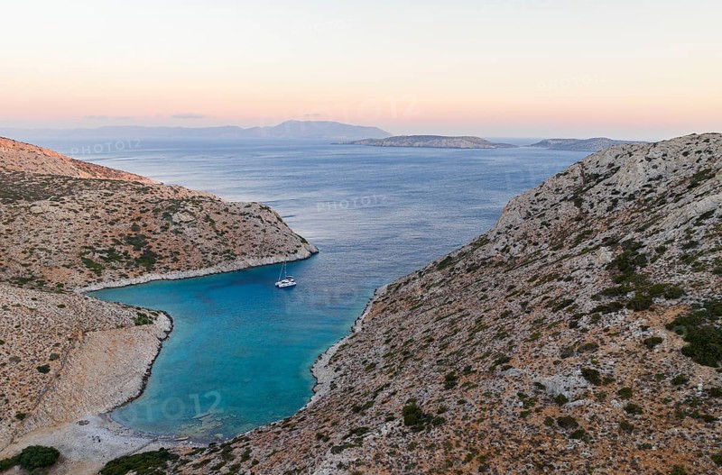 Sailing catamaran in a bay of Levitha Island