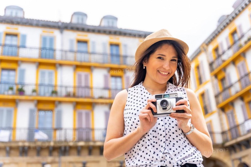 Tourist woman enjoying visiting the city looking at travel photos
