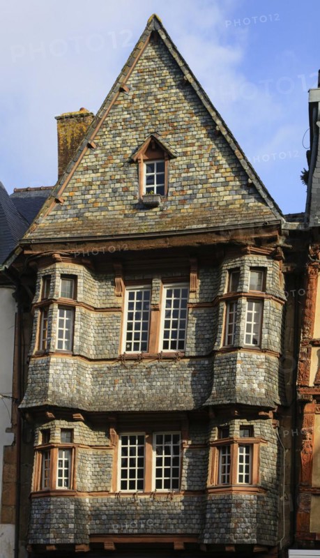 Half-timbered house clad in slate on the Place du General Leclerc