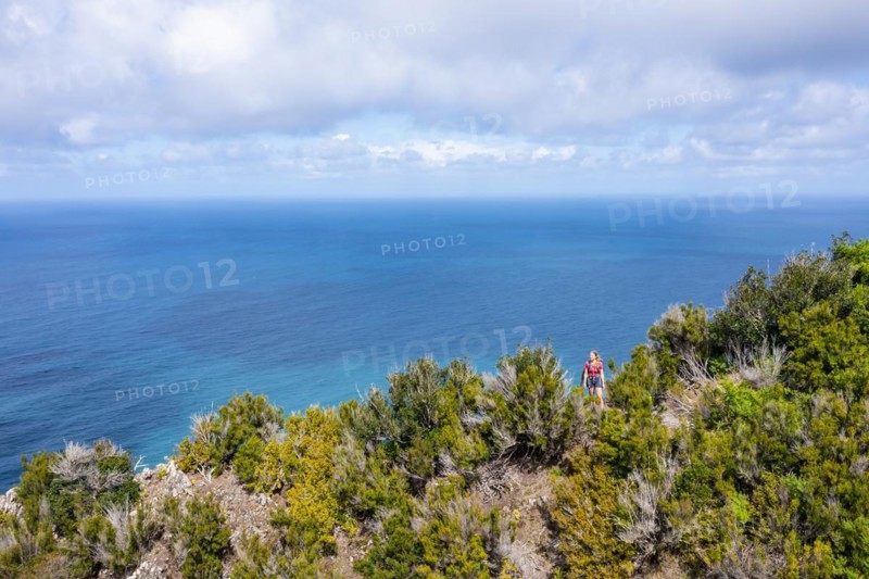 Hiker in front of the sea