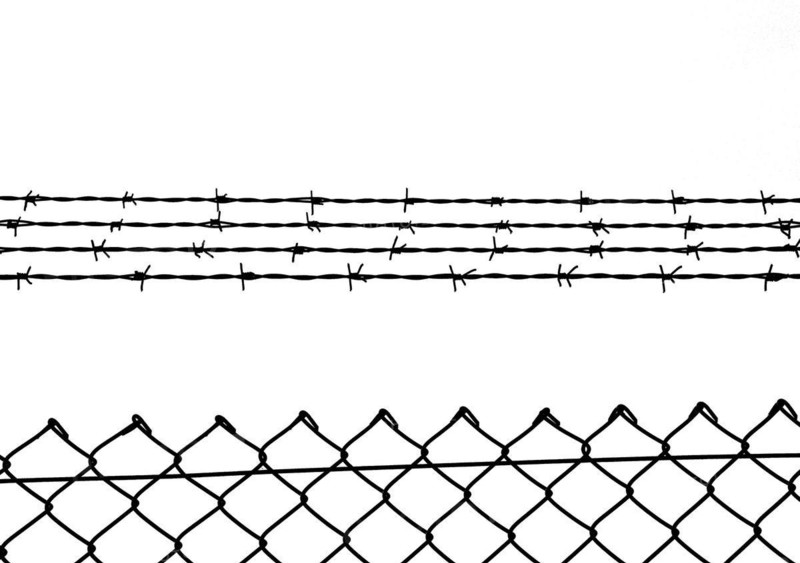 Chain link fence with additional barbed wire