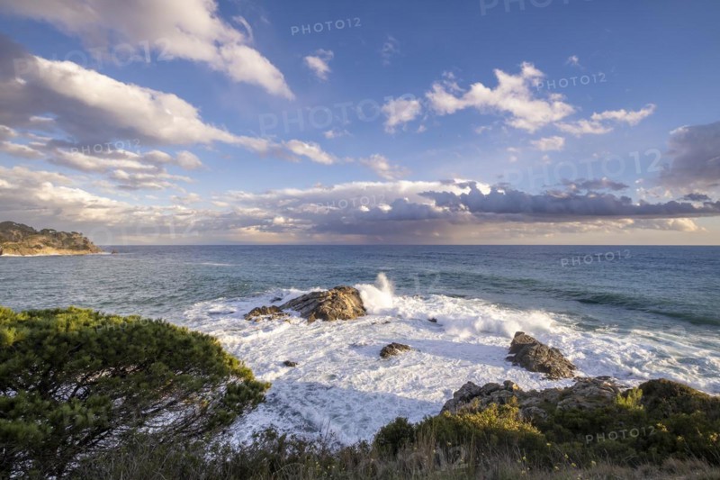 Landscape of stones and sea on the Costa Brava in Girona in Spain at sunset on a winter afternoon