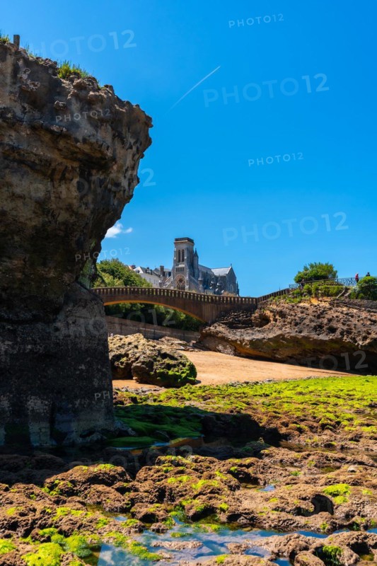 Low tide on the beach under the Basta Rock of Biarritz beach