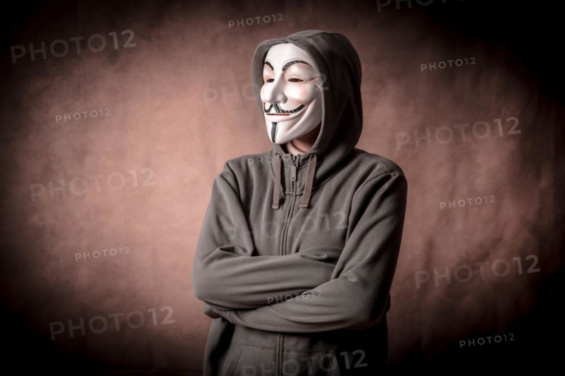 Man wearing anonymous mask with sweatshirt