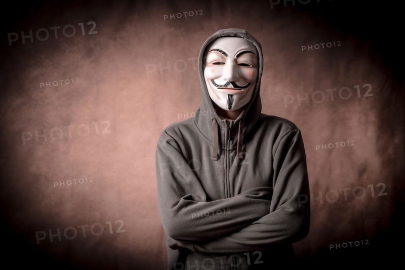 Man with anonymous mask with sweatshirt