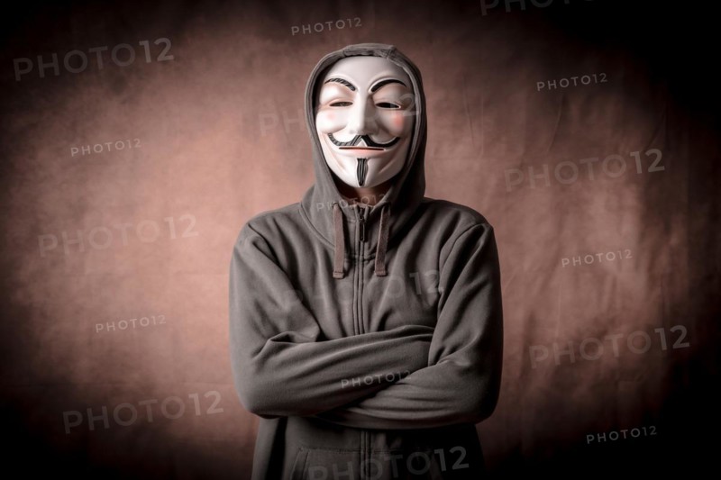 Man with anonymous mask with sweatshirt