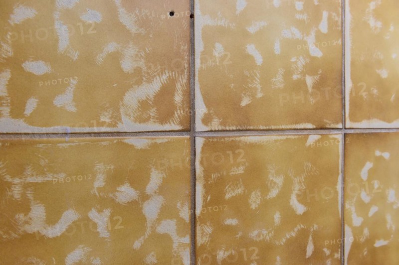 Tiler sanded off tiles to stick on new tiles