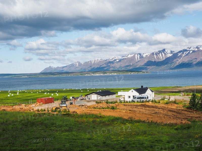 View over Eyjafoerour to the snow-capped mountains near Dalvik