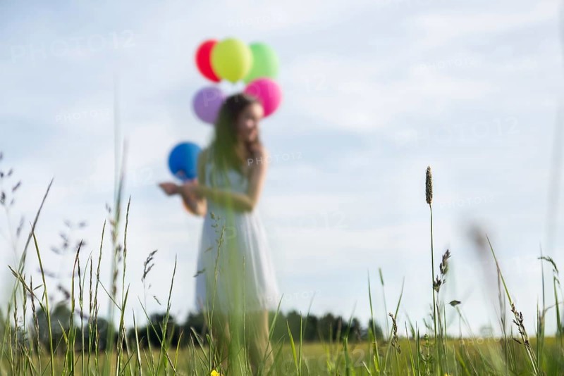 Little girl with balloons