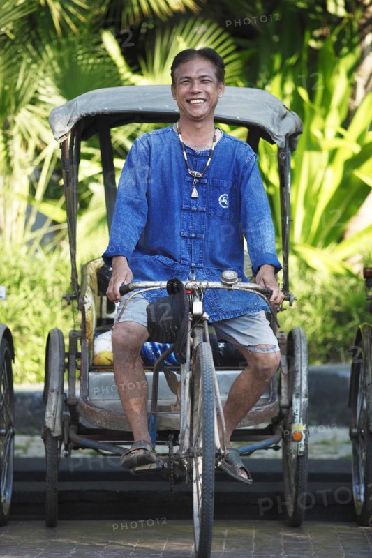 Laughing cycle rickshaw driver
