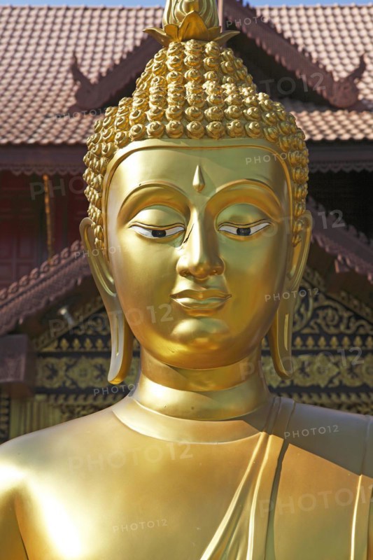 Golden Buddha figure in front of Wat Phra Bat Ming Muang