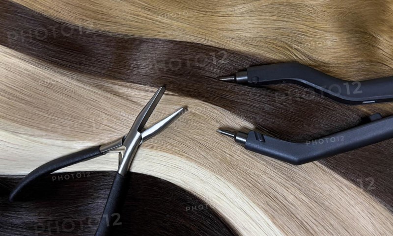 Strands of natural hair in different colors for extensions with tools