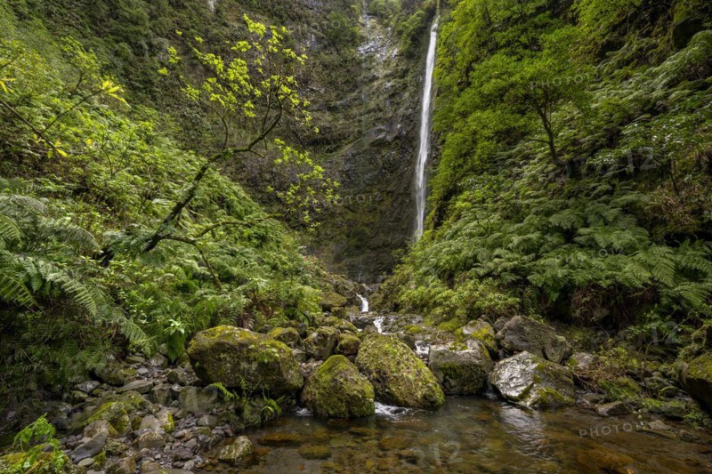 Waterfall on a steep rock face in the Caldeirao Verde