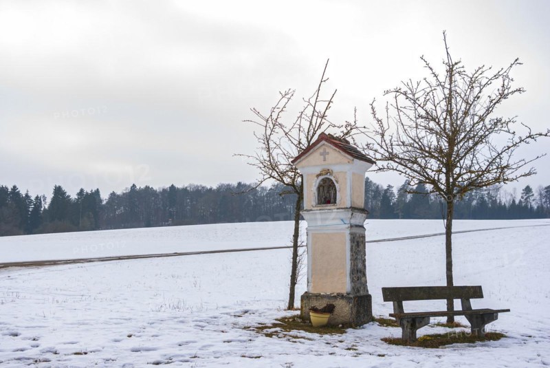 Catholic wayside shrine on the Swabian Alb in winter