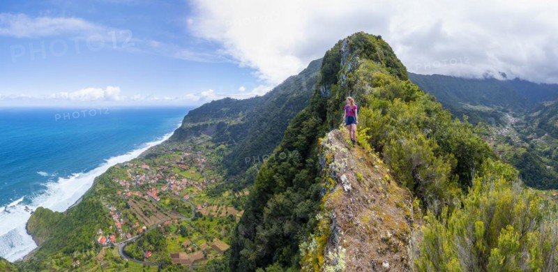 Hiker on the ridge of Pico do Alto