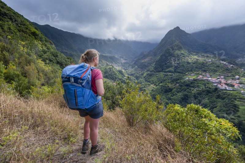 Hiker overlooking a mountain valley