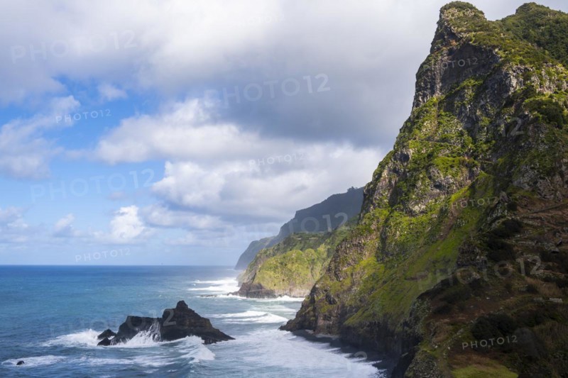 View of steep cliffs and coast with sea