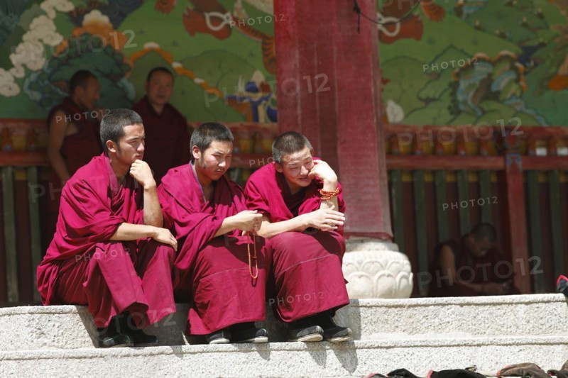 Monks on a staircase in Labrang Tibetan Monastery