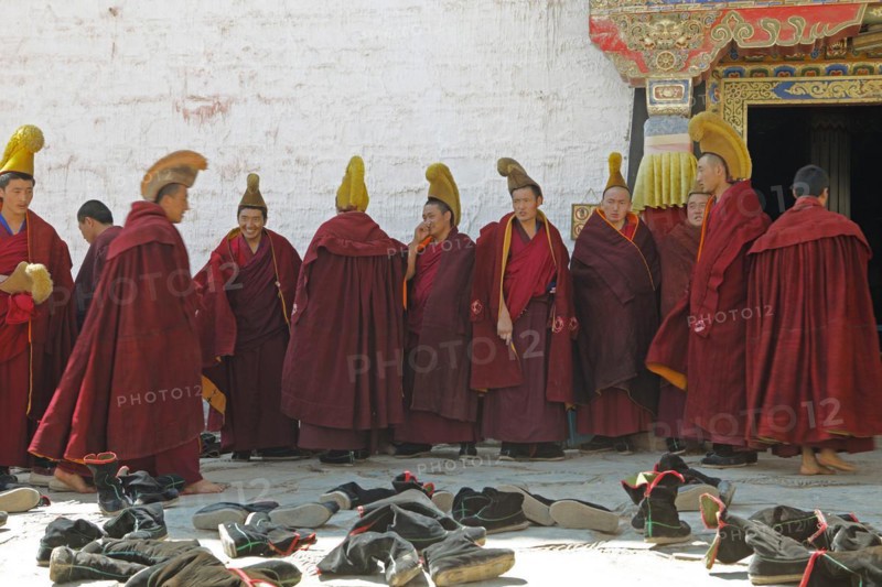 Yellow-capped monks at the prayer hall