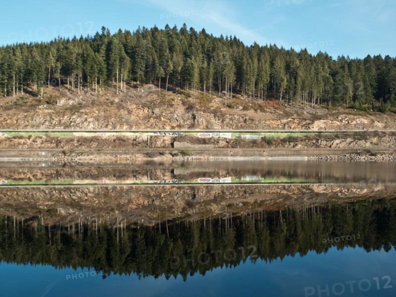 Reflection of the shore enclosure of the Schluchsee
